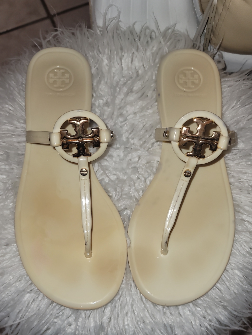 Tory Burch Ivory Logo T-Strap Jelly Sandals with Gold Accent